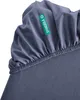 A close-up view of a dark blue fitted sheet with a green tag. Produktbild-Vorschau