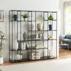 A modern living room with a black metal shelving unit filled with decorative items. Náhled obrázku produktu
