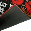 A close-up view of the corner of a doormat, showing the textured underside and the edge of the fabric. Produktbild-Vorschau