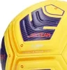 A close-up of a yellow and purple soccer ball. Podgląd zdjęcia produktu