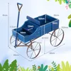 A blue wooden garden cart with dimensions indicated by measurement lines and text. Produktbild-Vorschau