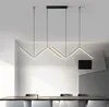 A modern dining room with a long table and chairs, illuminated by a unique LED pendant light. Produktbild-Vorschau