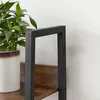 A close-up view of a shelf and the metal frame of a bookshelf, with a potted plant on the left. Podgląd zdjęcia produktu