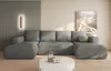 A modern living room scene featuring a large grey sectional sofa.