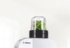 Close up shot of a kitchen appliance with a herb grinder attachment on top. Podgląd zdjęcia produktu