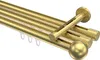 A close-up studio shot of a brass-colored curtain rod system. Produktbild-Vorschau