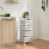 A white rolling cart with four mesh baskets is shown in a kitchen setting next to a wooden cabinet and sink. Podgląd zdjęcia produktu