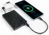 A power bank is charging a smartphone and a pair of wireless earbuds. Produktbild-Vorschau