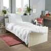 A child's bedroom with a bed, rug, and decor. Produktbild-Vorschau
