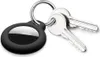 A black Apple AirTag holder with two silver keys attached to a silver keyring, all on a white background. Produktbild-Vorschau