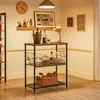 A bar cart stocked with bottles, glasses, and a basket of bread in a room. Produktbild-Vorschau