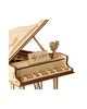 A close-up view of a wooden model grand piano. Podgląd zdjęcia produktu