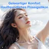 A young woman with her eyes closed, wearing earbuds, against a sky background. Produktbild-Vorschau