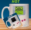 A mug designed to look like a Nintendo Game Boy, with a smaller image of the mug in the foreground. Produktbild-Vorschau