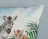 A close-up of a pillow with a jungle animal print. Anteprima dell’immagine prodotto