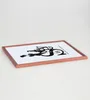 A framed picture with black text on a white background, resting on a light-colored surface. Produktbild-Vorschau
