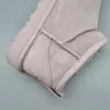 A close-up view of a light gray UGG boot. Produktbild-Vorschau