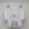 The underside of a white Bomann foot bath with purple feet is shown against a white background. Náhľad obrázku produktu