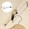 A closet rod extender mounted to a wooden surface, with a hanger shown. Produktbild-Vorschau
