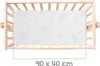 A baby crib with a mattress inside, viewed from above. Produktbild-Vorschau