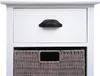 A close-up of a white wooden chest of drawers with a black handle and a gray woven basket. Anteprima dell’immagine prodotto