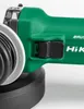 Close-up of a green power tool with a black switch. Voir les images du produit