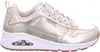 A side view of a gold Skechers sneaker. Voir les images du produit