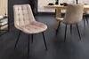 Two dining chairs are shown in a dining room setting with a wooden table in the background. Produktbild-Vorschau
