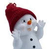 A close-up of a decorative snowman figure wearing a red knitted hat. Produktbild-Vorschau