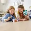 Two young girls are playing with LEGOs on a table. Anteprima dell’immagine prodotto