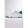 A white Puma sneaker with green accents is shown against a white background. Produktbild-Vorschau