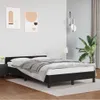A bedroom scene with a black bed frame and bedding. Podgląd zdjęcia produktu