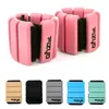 A product shot of pink ankle and wrist weights, with a row of other colored weights below. Podgląd zdjęcia produktu