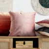 Several pillows are displayed on a wooden cabinet with a woven front. Podgląd zdjęcia produktu