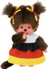 A plush toy Monchhichi doll wearing a dress in the colors of the German flag and bows in its hair also in the German flag colors. Náhled obrázku produktu