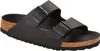 A black Birkenstock Arizona sandal is shown from a side-angle on a white background. Produktbild-Vorschau