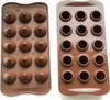Two chocolate molds are shown side-by-side against a light gray background. The mold on the left has 12 cavities with a swirled, conical shape, some filled with white cream. The mold on the right has 12 cavities with a fluted, circular shape, appearing emp Produktbild-Vorschau