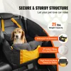 A dog is sitting in a car seat designed for pets. Náhled obrázku produktu