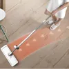 A person is mopping a wooden floor with a microfiber mop. Podgląd zdjęcia produktu