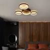 A modern bedroom interior with a stylish ceiling light fixture. Voir les images du produit