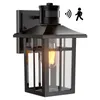 A black outdoor wall lantern with a motion sensor. Produktbild-Vorschau