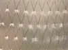 A close-up view of a net of white LED lights against a light gray background. Náhľad obrázku produktu