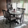 A dining room with a table and chairs, illuminated by sunlight streaming through blinds. Náhľad obrázku produktu