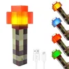 A product shot of a Minecraft-style torch lamp, with multiple color options shown on the right, and USB charging cables in the foreground. Náhled obrázku produktu