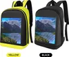 Two backpacks, one yellow and one black, are displayed side-by-side against a white background. Both backpacks feature a digital LED screen displaying a landscape image. Podgląd zdjęcia produktu