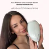 A woman is holding an IPL hair removal device. Produktbild-Vorschau