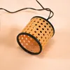 A close-up shot of a decorative solar light string with a woven basket-like design. Produktbild-Vorschau