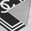 A close-up view of the corner of a rug, showing the texture of the backing and the edge of the design. Produktbild-Vorschau