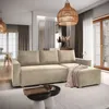 A modern living room with a sectional sofa, coffee table, and decorative elements.
