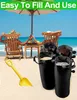 Two people relaxing on a beach under an umbrella, with sandbags and a shovel in the foreground. Produktbild-Vorschau